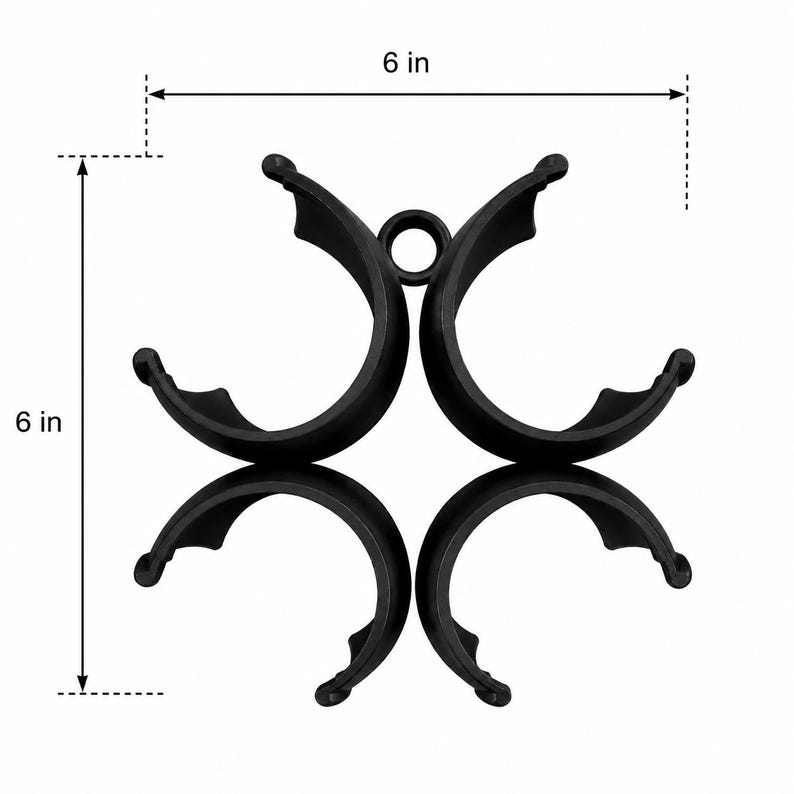 Puede incluir: Una pieza de conexi&oacute;n circular negra de cuatro partes con un anillo central, que presenta un dise&ntilde;o sim&eacute;trico. Las l&iacute;neas de cota indican un ancho de 15,24 cm y una altura de 15,24 cm, mostrando la escala de este componente funcional.
