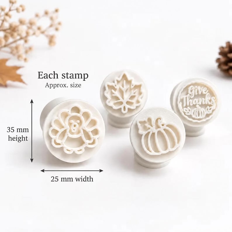 May include: Four white circular stamps featuring Thanksgiving designs including a turkey, a maple leaf, a pumpkin, and the text Give Thanks with a pumpkin. Each stamp measures 35 mm in height and 25 mm in width as indicated by the labels.
