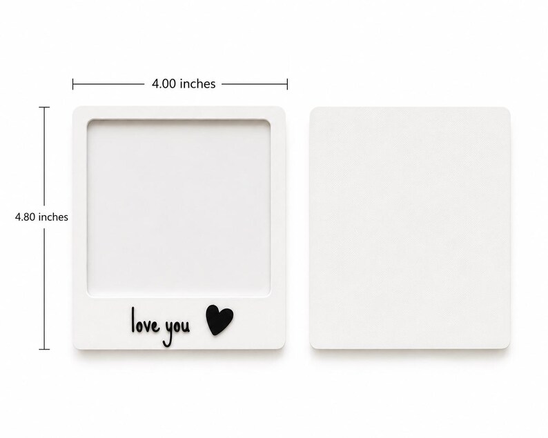 May include: Two white square frames, one with a hollow center and the text "love you" with a black heart icon. The frame measures 4.00 inches in width and 4.80 inches in height. The second frame is a solid white square of the same dimensions.