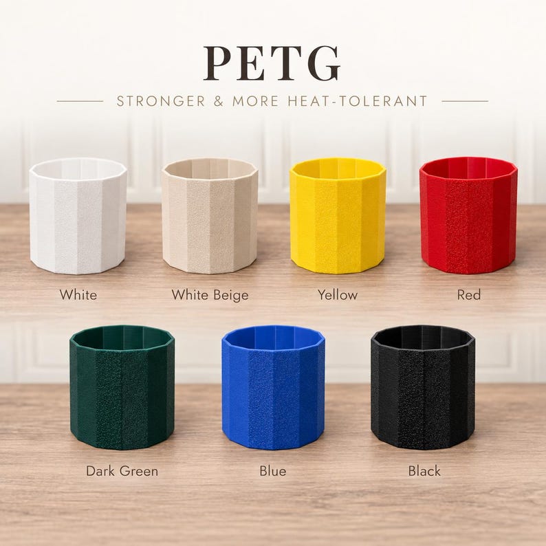 May include: Seven cylindrical PETG containers with a faceted exterior surface, arranged in two rows. The colors include white, white beige, yellow, red, dark green, blue, and black. The text PETG STRONGER & MORE HEAT-TOLERANT is visible above.