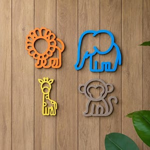 May include: Four colorful wooden animal cutouts: an orange lion, a blue elephant, a yellow giraffe, and a gray monkey. The animal shapes are mounted on a wooden wall, creating a playful and decorative theme.