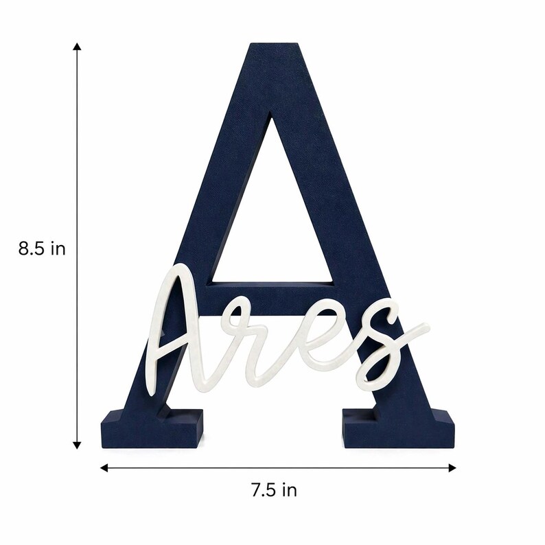 May include: A navy blue wooden letter "A" with the name "Ares" in white script. The letter is 21.6 cm tall and 19.1 cm wide. This decorative piece is suitable for nursery decor or personalized gifts.