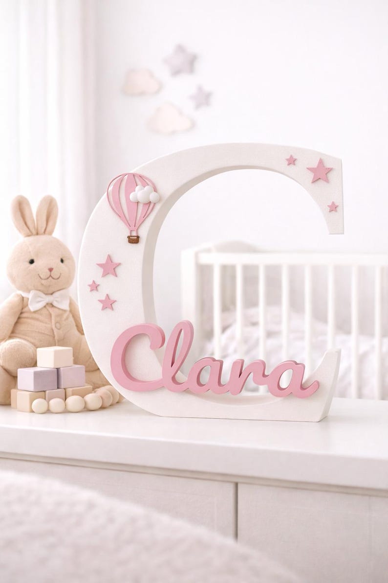 Clara personalized name sign in a crib
