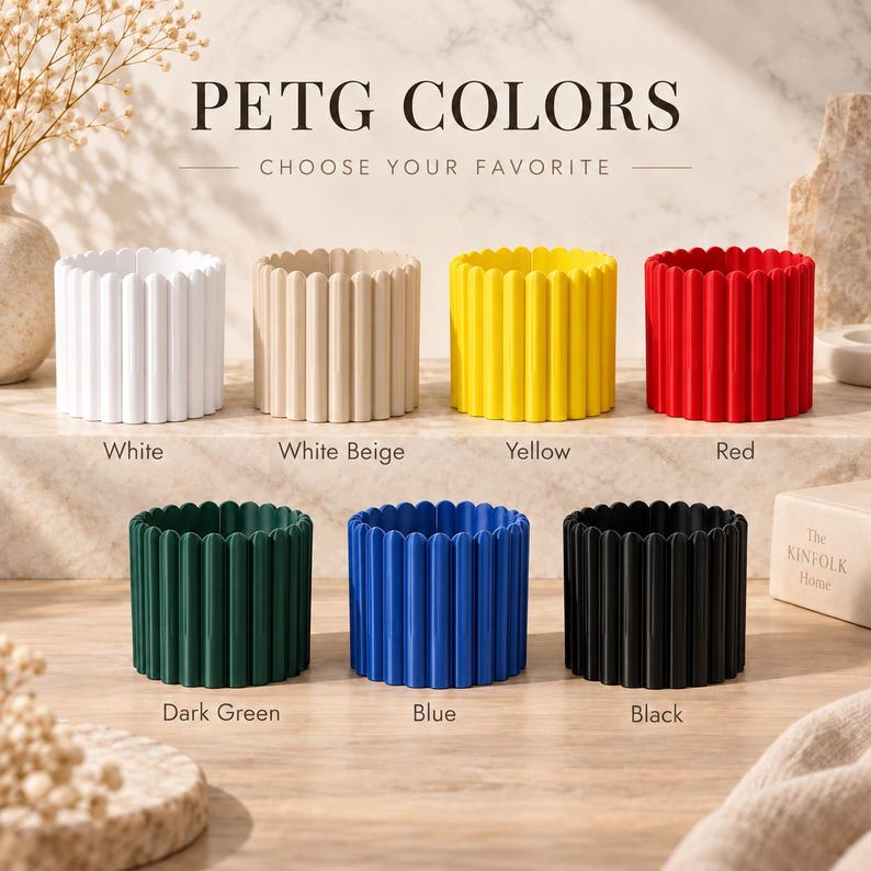 May include: Seven cylindrical PETG planters with a vertical ribbed texture, displayed in white, beige, yellow, red, dark green, blue, and black. The text PETG COLORS CHOOSE YOUR FAVORITE is visible at the top, with color names below each item.