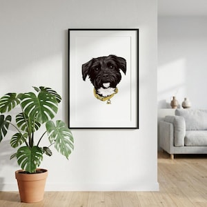 May include: Framed art print featuring a black and white dog portrait. The dog has a yellow collar with a small tag. The artwork is displayed in a black frame against a white wall. A potted plant is in the foreground.