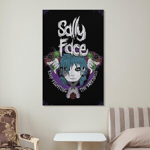 May include: A black poster featuring the text "Sally Face" in white, above a character illustration with blue hair and a prosthetic face. The phrase "Keep Fighting The Darkness" encircles the character. The artwork includes green and red accents.