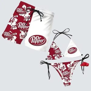May include: Red and white Dr. Pepper themed swimwear set. The set includes swim trunks and a bikini. The swim trunks are half red with white floral patterns and half white. The bikini is red with white floral patterns and white.