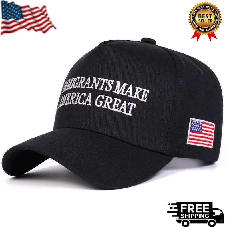May include: Black baseball cap with the embroidered text "Immigrants Make America Great" in white. Features a small American flag patch on the side. A waving American flag is in the upper left corner.
