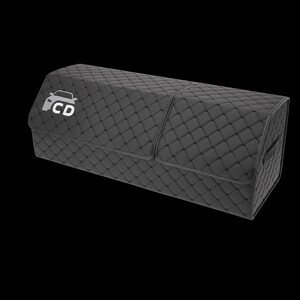 May include: A black, quilted car trunk organizer with a rectangular shape. The organizer features a diamond pattern and a white car logo with the letters "CD". It has a hinged lid and a handle on the side.
