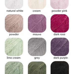 May include: A color chart displaying twelve yarn colors, including natural white, cream, powder pink, powder, mauve, dark rose, lime cream, grey, dark purple, sage green, dark green, and black. The word "Colours" is at the top.