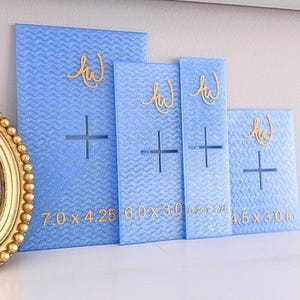 May include: Four light blue rectangular acrylic templates with a textured wavy surface. Each piece features a gold cursive logo, a central cross-shaped cutout, and printed dimensions of 7.0 x 4.25, 6.0 x 3.0, 6.25 x 1.75, and 4.5 x 3.0 inches.
