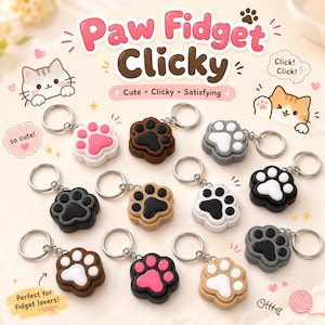 May include: A collection of eleven paw-shaped fidget keychains in various color combinations including pink, white, black, brown, and gray. Each keychain features a metal ring and a tactile paw design with raised pads. Text reads Paw Fidget Clicky.
