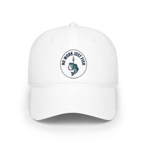 May include: White baseball cap with a curved brim. The cap features a circular emblem with a fish on a hook, and the text "NO WORK JUST FISH" in navy blue.