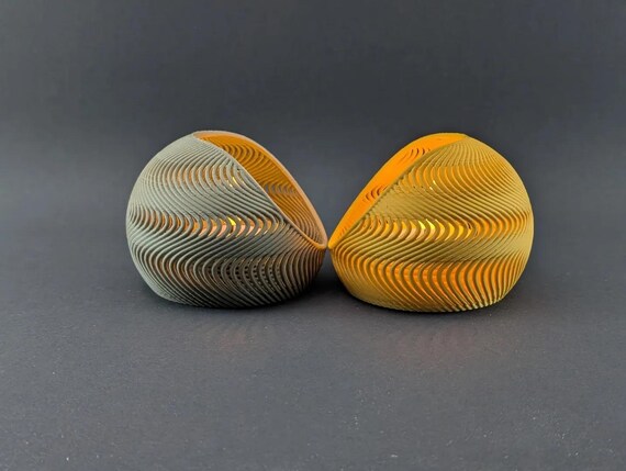 Rear view of two TideNest holders showing the continuous wave pattern