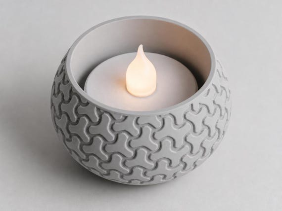 Raised top view of an Ash Gray Interlock VowGlow holder showing its circular opening and flameless LED tealight
