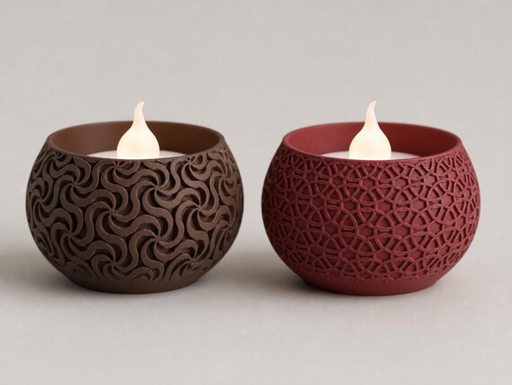 Close-up of Dark Brown Pinwheel and Dark Red Loop Lattice VowGlow LED tealight holders