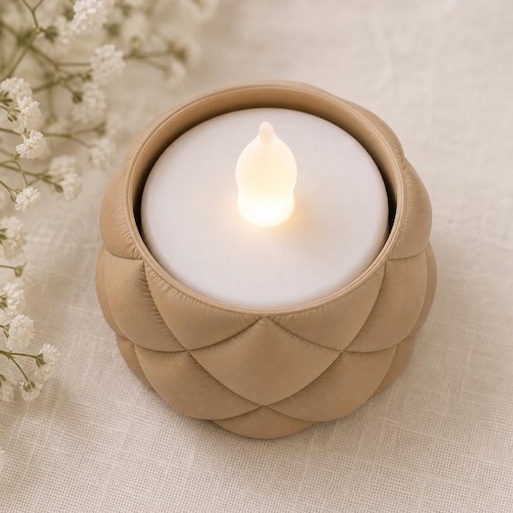 Overhead close-up of a Desert Tan low VowLoom holder showing the circular opening and flameless LED tealight