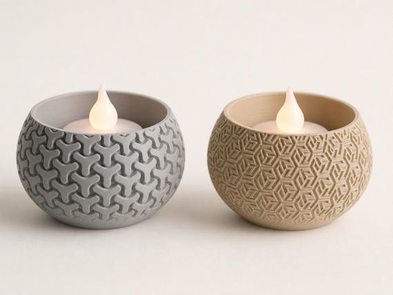 Close-up of Ash Gray Interlock and Desert Tan Star Maze VowGlow LED tealight holders