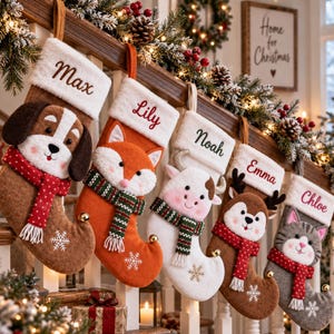 May include: Five felt Christmas stockings hanging on a wooden staircase railing. Each stocking features a plush animal face, a patterned scarf, a white cuff with a name embroidered in script, and a snowflake detail. The names are Max, Lily, Noah, Emma, and Chloe.