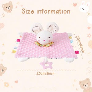 May include: A pink plush security blanket featuring a white mouse head with embroidered facial features, a colorful floral collar, and multiple small fabric tags on the sides. A star-shaped teether is attached. Dimensions are 8 inches by 8 inches.