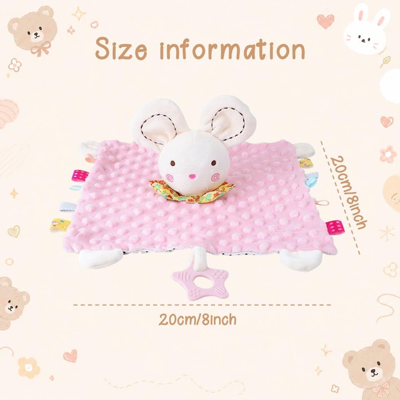 May include: A pink plush security blanket featuring a white mouse head with embroidered facial features, a colorful floral collar, and multiple small fabric tags on the sides. A star-shaped teether is attached. Dimensions are 8 inches by 8 inches.