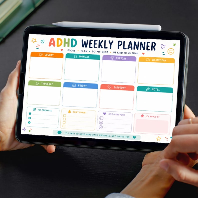 May include: A digital ADHD weekly planner displayed on a tablet screen. The layout features colorful sections for each day of the week, plus areas for top priorities, a self-care plan, and notes. Text includes ADHD WEEKLY PLANNER and IT'S OKAY TO HAVE HARD DAYS: PROGRESS, NOT PERFECTION.