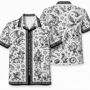 May include: White button-up shirt with a black and white fantasy-themed print. The design includes dragons, griffins, dinosaurs, and other mythical creatures. The shirt has short sleeves and the text "FORGE YOUR LEGACY".