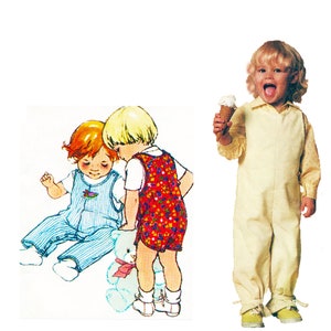 May include: Three children wearing overalls. Two children are playing with a teddy bear. One child is holding an ice cream cone.