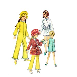 May include: Four children wearing pajamas and nightcaps. The girl on the left is wearing a yellow jumpsuit with a yellow nightcap. The girl in the center is wearing a red and white patterned robe with a red nightcap. The girl on the right is wearing a blue and white patterned dress. The girl in the back is wearing a white robe with a white nightcap.