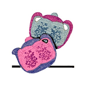 May include: Two crocheted pot holders in pink, blue, and gray. The pot holders are shaped like bears and have a textured pattern.