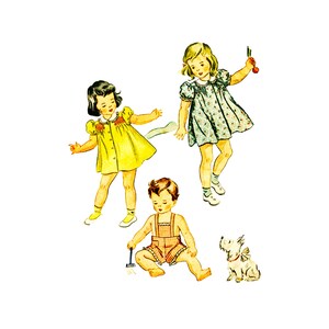 May include: Three children, two girls and a boy, are playing outdoors. The girls are wearing dresses, one yellow and one blue with white flowers. The boy is wearing overalls. A small white dog is sitting on the ground.