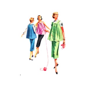 May include: Three women wearing different styles of dresses. The woman in the center is wearing a pink and white polka dot dress. The woman on the left is wearing a blue dress. The woman on the right is wearing a green dress.