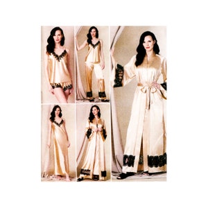 May include: Four images of women wearing different styles of satin nightwear. The nightwear is all in a light gold colour with black lace trim. The first image shows a woman wearing a camisole and shorts. The second image shows a woman wearing a camisole and trousers. The third image shows a woman wearing a long robe. The fourth image shows a woman wearing a long robe.