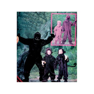 May include: A selection of animal costumes, including a black gorilla suit, a brown bear suit, and two monkey suits. The costumes are set against a backdrop of a forest scene, with a pink border around the bear suit.