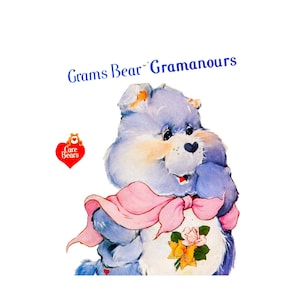 May include: Illustration of Grams Bear from Care Bears, a light blue bear with a pink scarf and a floral design on its belly. The bear has a heart-shaped nose and is smiling. The words "Grams Bear Gramanours" are written above the bear.