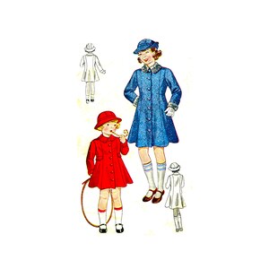 May include: Two girls wearing coats and hats. The girl on the left is wearing a red coat and a red hat. The girl on the right is wearing a blue coat and a blue hat. The girl on the left is holding a hoop.