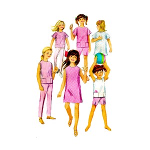 May include: A vintage sewing pattern illustration featuring six children wearing various summer outfits including pink polka dot dresses, striped trousers and tops, and white shorts sets. The children are depicted with accessories like a beach ball.
