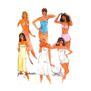 May include: A collection of illustrated sleepwear designs by Jann Johnson, featuring various styles including camisoles, shorts, and nightgowns in shades of blue, pink, yellow, and white, with delicate lace trim and small floral patterns throughout.