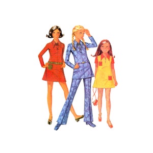 May include: Three women wearing different outfits from the 1960s. The woman on the left is wearing a red mini dress with a brown belt and white boots. The woman in the middle is wearing a blue patterned pantsuit with a white collar and white boots. The woman on the right is wearing a yellow mini dress with a red collar and red and white striped tights.