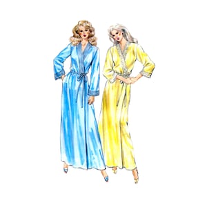 May include: A fashion illustration of two floor-length robes. The left robe is light blue with long sleeves, a tie waist, and ribbed trim. The right robe is yellow with long sleeves, a tie waist, and white lace trim along the collar and cuffs.