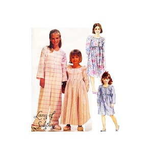 May include: Three girls wearing different styles of nightgowns. The girl on the left is wearing a pink and white plaid nightgown. The girl in the middle is wearing a pink and white striped nightgown. The girl on the right is wearing a blue and white striped nightgown. The text "Lanz of Salzburg" is visible in the bottom left corner of the image.