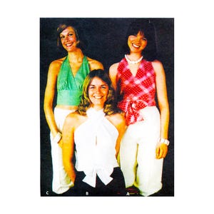 May include: Three women wearing halter tops and white pants. The tops are in green gingham, white with a bow, and red and pink plaid. The image is a vintage fashion photograph.