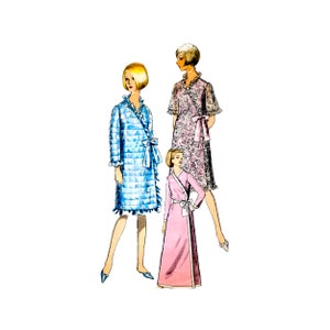 May include: Three women wearing different styles of robes. The woman on the left is wearing a blue and white checkered robe with a ruffled collar. The woman in the middle is wearing a pink robe with a ruffled collar. The woman on the right is wearing a floral print robe with a ruffled collar.