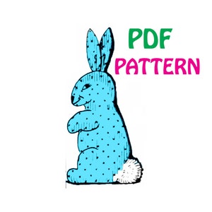 May include: PDF pattern for a blue bunny with white polka dots and a white fluffy tail. The pattern is for a stuffed toy.