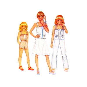 May include: Three girls wearing different summer outfits. The girl on the left is wearing a plaid shorts set with red and white stripes. The girl in the middle is wearing a white dress with a blue trim. The girl on the right is wearing a white top with a white skirt and pants.