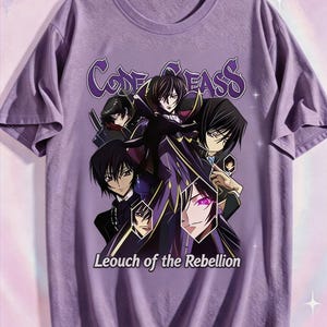 May include: A lilac-colored t-shirt featuring a graphic of anime characters. The text "Code Geass" is arched across the top, with "Leouch of the Rebellion" below. The design includes multiple figures in dark clothing.