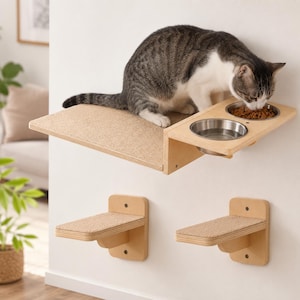 May include: A wall-mounted cat furniture set featuring a light wood platform with two integrated stainless steel bowls and two separate smaller wood shelves. Each shelf surface is covered in a textured beige material for traction.