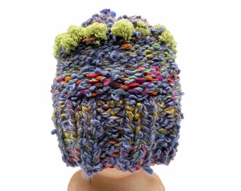 544 LINCOLN CAP HAT: Wicked rich colors and wonderful textures. Funky, warm, handknit with a giant removable button.