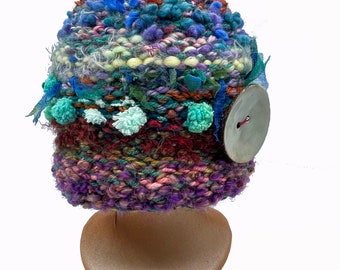 515 Vienna roll HAT with wild & funky colors and a moveable/removable fashion button.