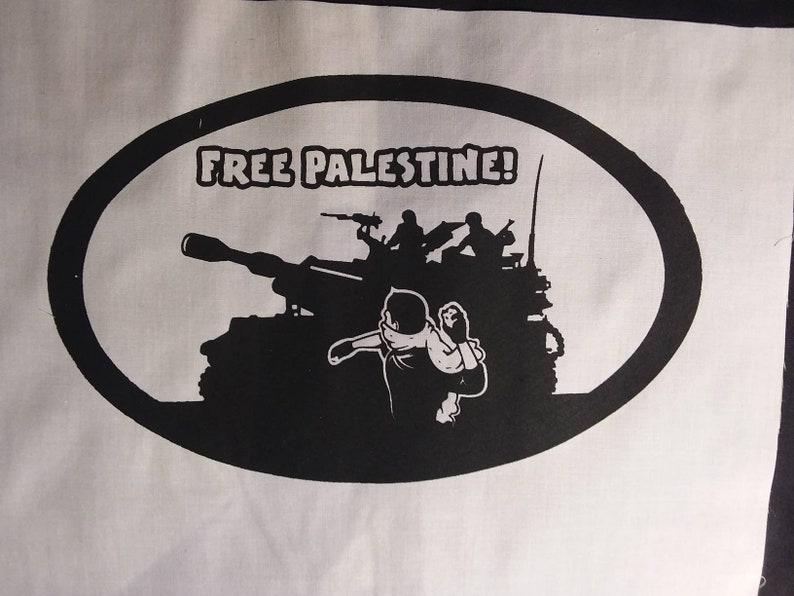 May include: Black and white illustration of a tank with soldiers on top. The tank is in an oval shape with the text "FREE PALESTINE!" above it.